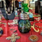 An eclectic blend of jewelry, collectibles, essential oils, decorative flags and crystals